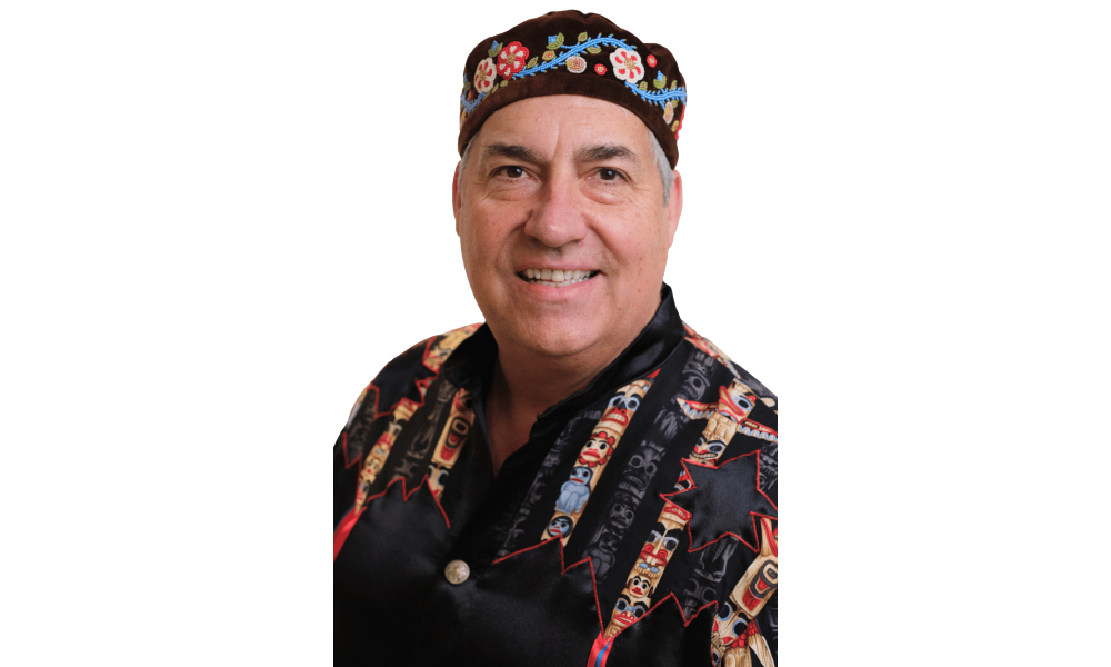 Headshot of a man wearing a Metis beaded hat.