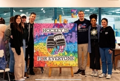 MNBC Staff with Hockey Is for Everyone Sign